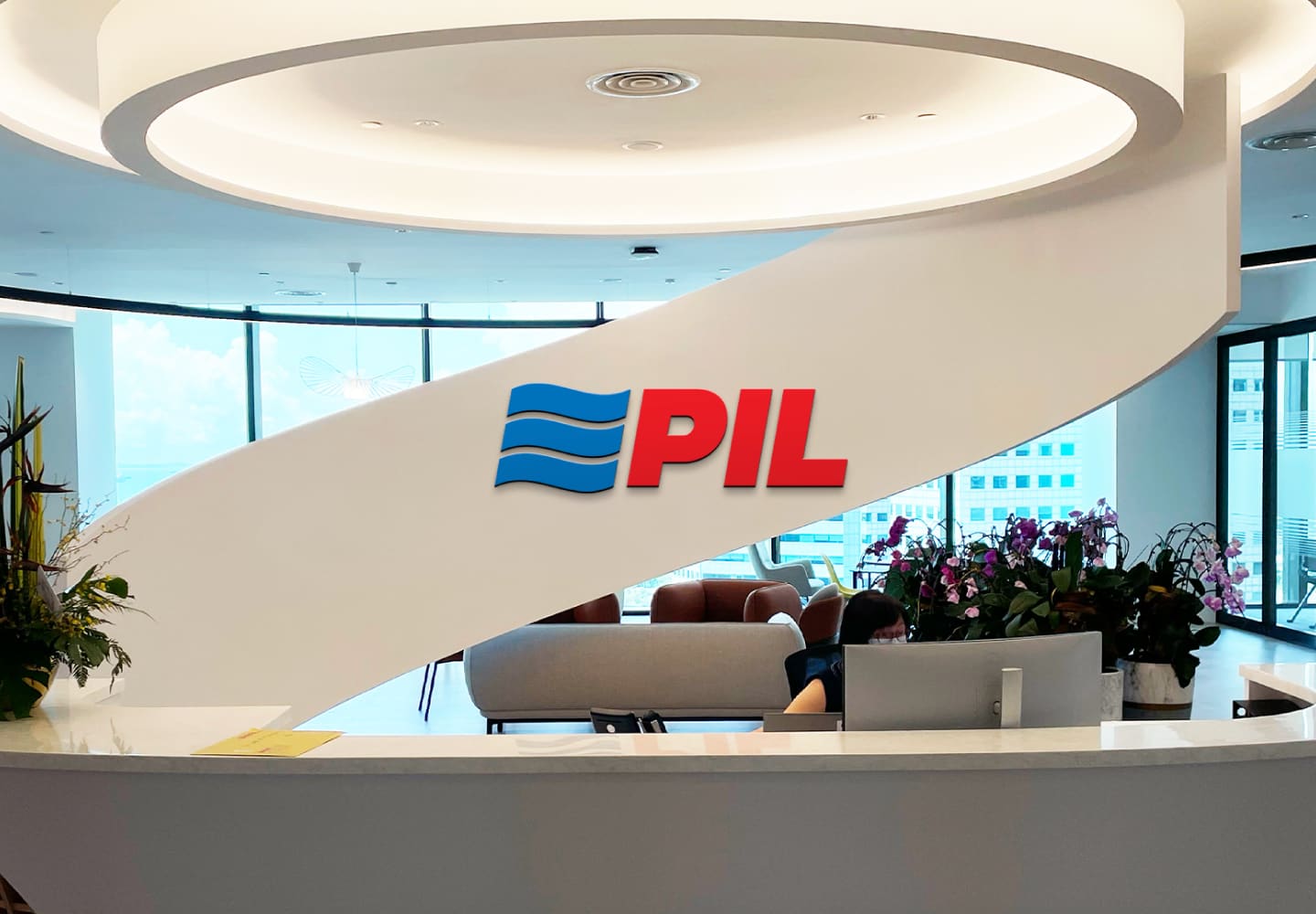 PIL logo on the curved reception wall of the head office