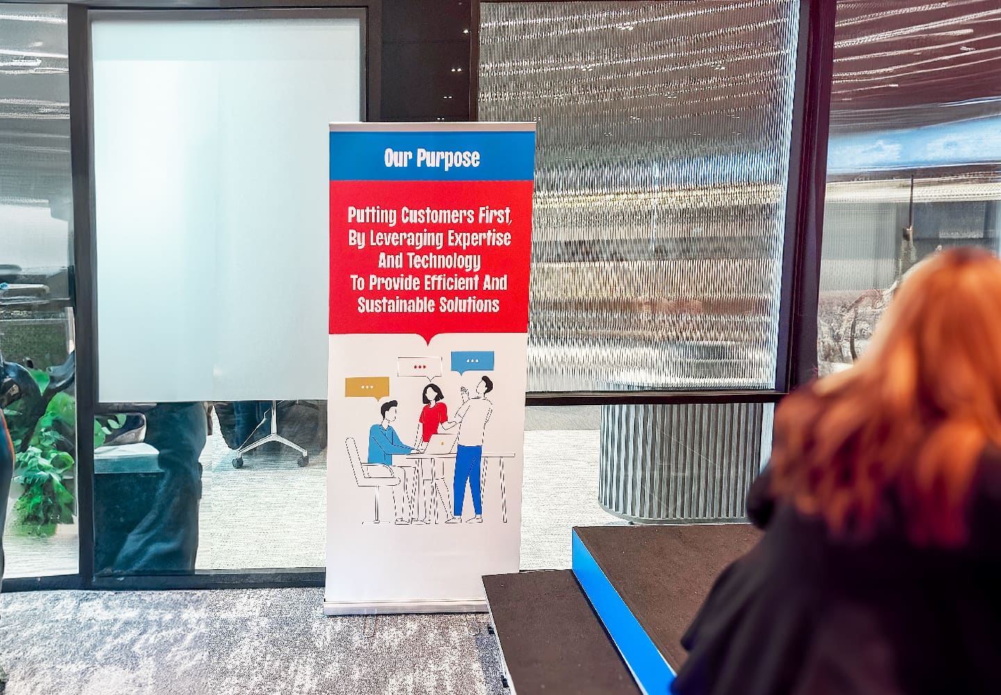 “Our Purpose” roll-up banner in the office